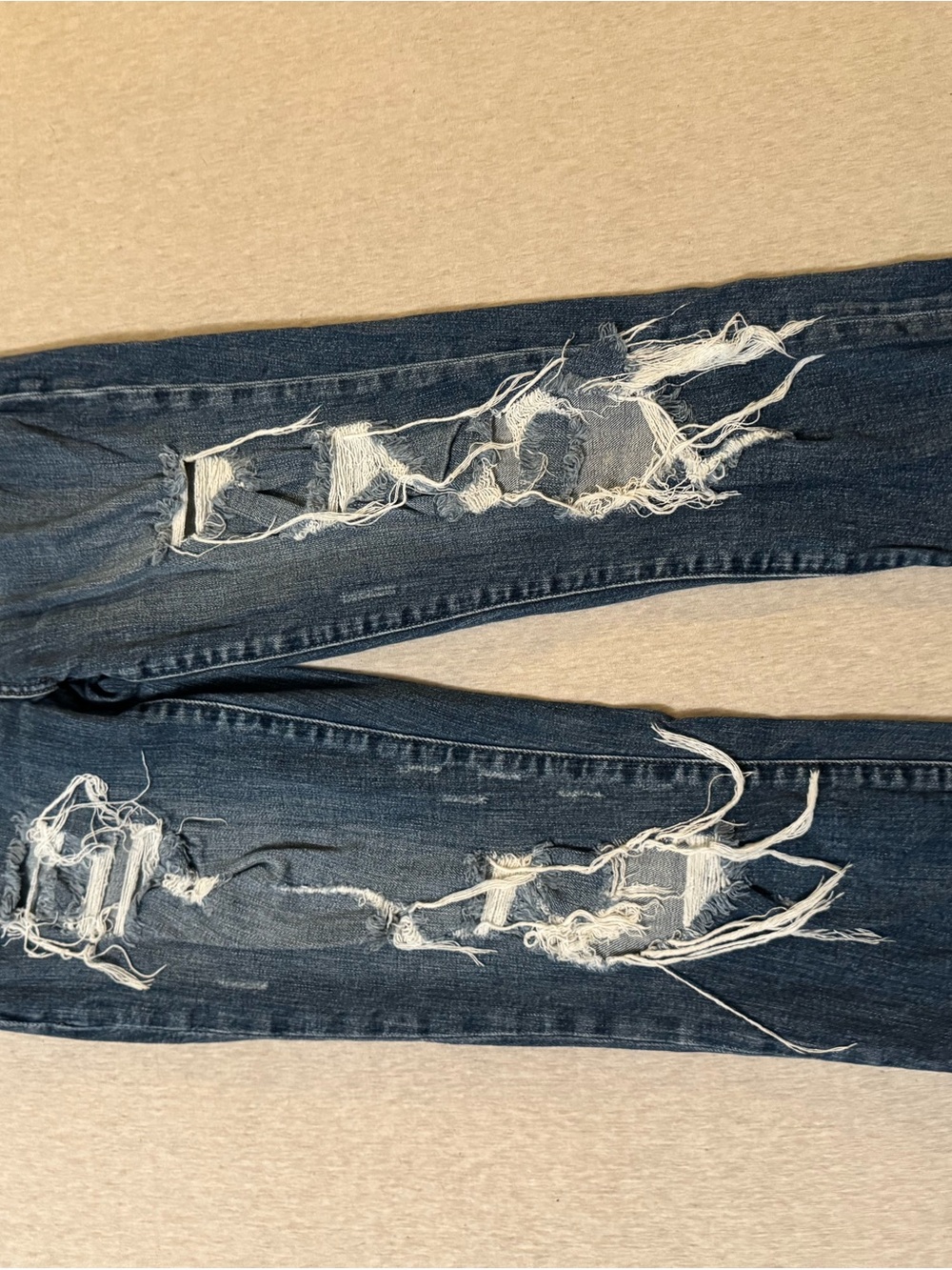 Distressed Dark Blue Ripped Jeans
